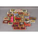 Approximately thirty boxed model die cast collectors cars, vans, lorries, buses, etc,