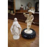 A Japanese Meiji period ivory figure of a farmer, standing, holding a rake,