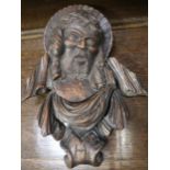 A carved wooden bust of Christ