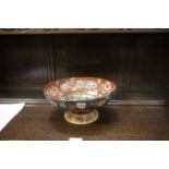 A reproduction Japanese style pedestal dish circular