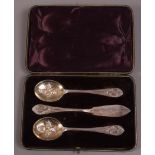 An early 20th century cased set of EPNS preserve spoons and matching butter knife,