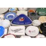 A quantity of ceramic pub ashtrays including Guinness, Cluny Scotch Whisky, Johnnie Walker Scotch,