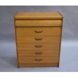 A teak chest of six drawers with curved handles, c.