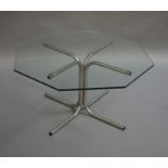 A glass and chrome tubular coffee table, octagonal outline,