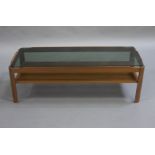 A teak and brown tinted glass inset coffee table, c.