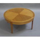 A teak quarter-veneered circular coffee table, c.