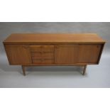 White and Newton Ltd., Portsmouth, 'Drummond' model D535 afromosia dining suite, c.