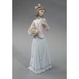 A Lladro figure, Innocence in Bloom, 25cm high,