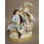 A Meissen porcelain figure group finely modelled with a courting couple before a pedestal with urn,