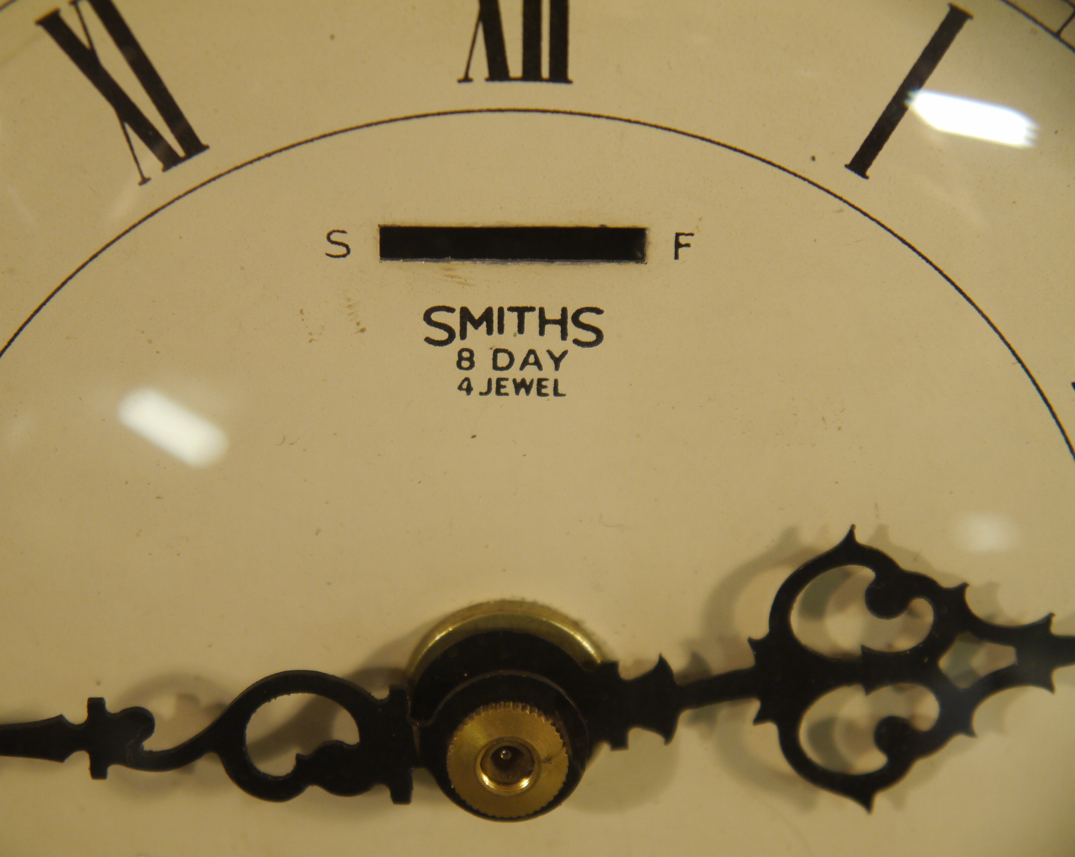 An Atsonia cartouché clock with cream enamelled dial with Roman numerals inscribed Smith's eight - Image 2 of 2