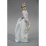 A Lladro figure, Basket of Love, 25cm high,