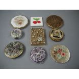 Nine various compacts, brass, gilt metal, enamelled, etc, 8.