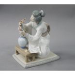 A Lladro figure: Oriental girl, 19cm high,