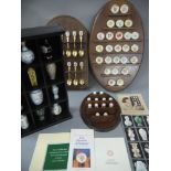 A collection of spoons, thimbles,