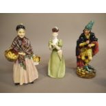 Three Doulton figures, The Orange Lady, registration number 812348, 22cm high; The Pied Piper,