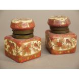 A pair of French porcelain ink wells with faceted bun shaped covers brass mounts,