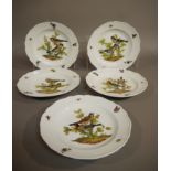 A set of five Meissen shaped circular plates printed and painted with birds on branches,