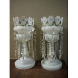 A pair of Victorian milk glass lustre stands decorated with flowers and leafage in formal palmette