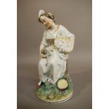 A Staffordshire potter figure of a young woman holding a basket in her left hand and a bird in her