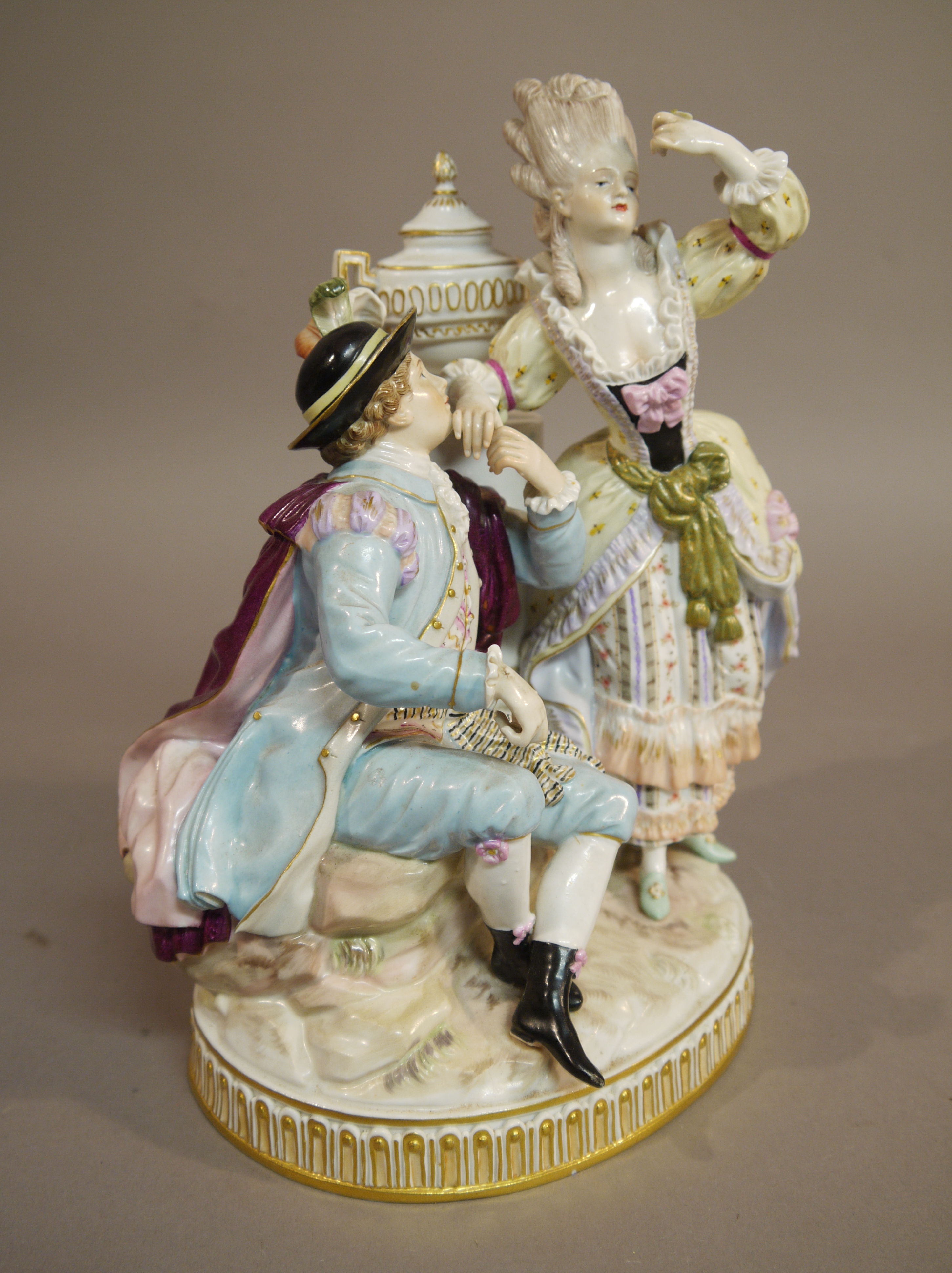 A Meissen porcelain figure group finely modelled with a courting couple before a pedestal with urn, - Image 2 of 3