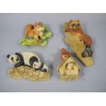 Four Bossons plaster moulded figures including squirrel, racoon, pandas and chipmunks,