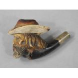 A Victorian meerschaum pipe bowl carved as a bearded gentleman with hat,