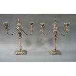 A pair of silver plated two branch candelabrum in George III style,