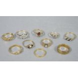 A collection of rings in 9ct gold variously set with sapphire, garnet and cubic zirconia,