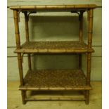 A three tier faux bamboo and wicker stand, 64cm wide,