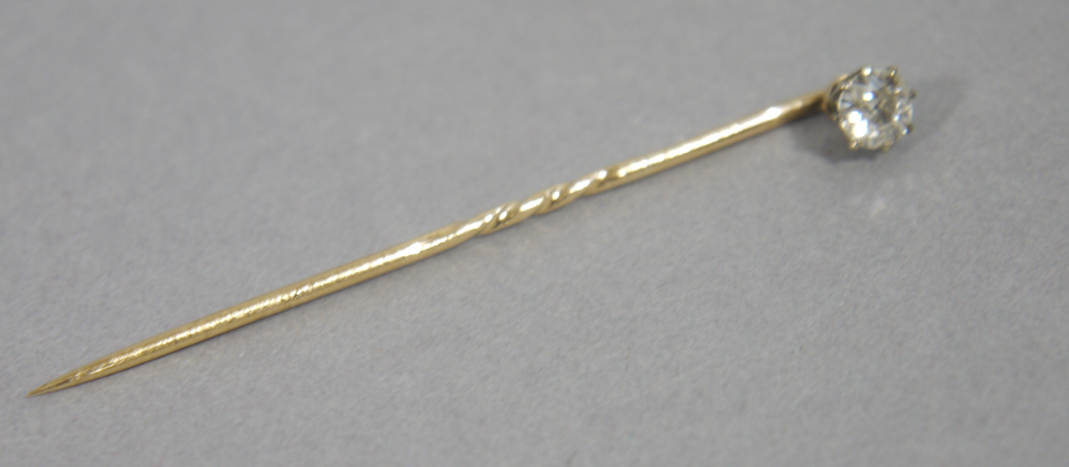 An Edward VII diamond tie pin, in 15ct yellow and white gold,