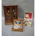 Three jewellery boxes including a glazed cabinet fitted with drawers and chain rack,