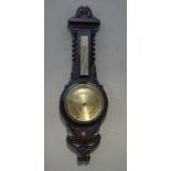 An oak barometer with thermometer the brass dial inscribed H Miller optician 52 Albion Street,