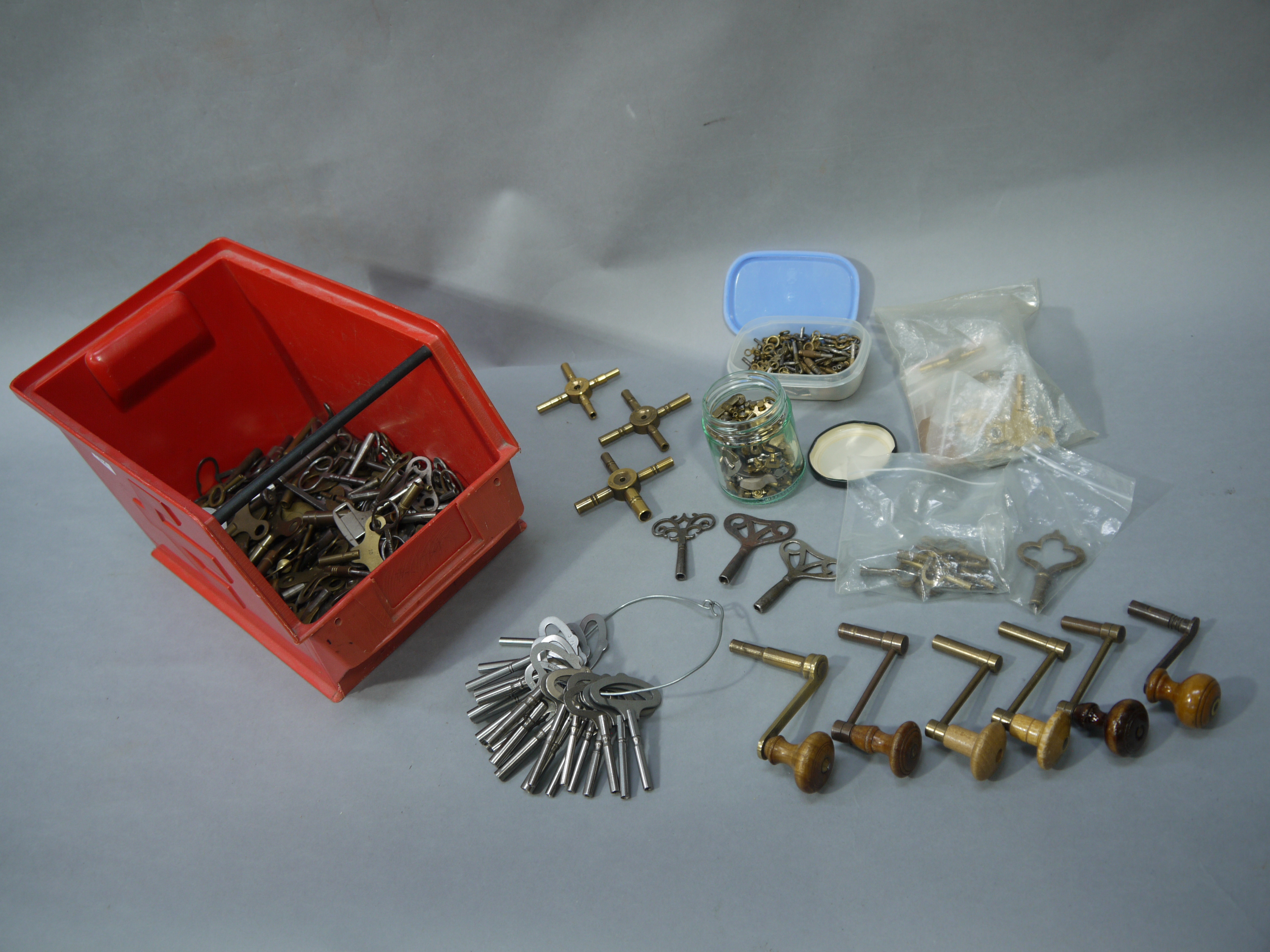 A large collection of clock and pocket watch keys including, brass double ended carriage clock keys,