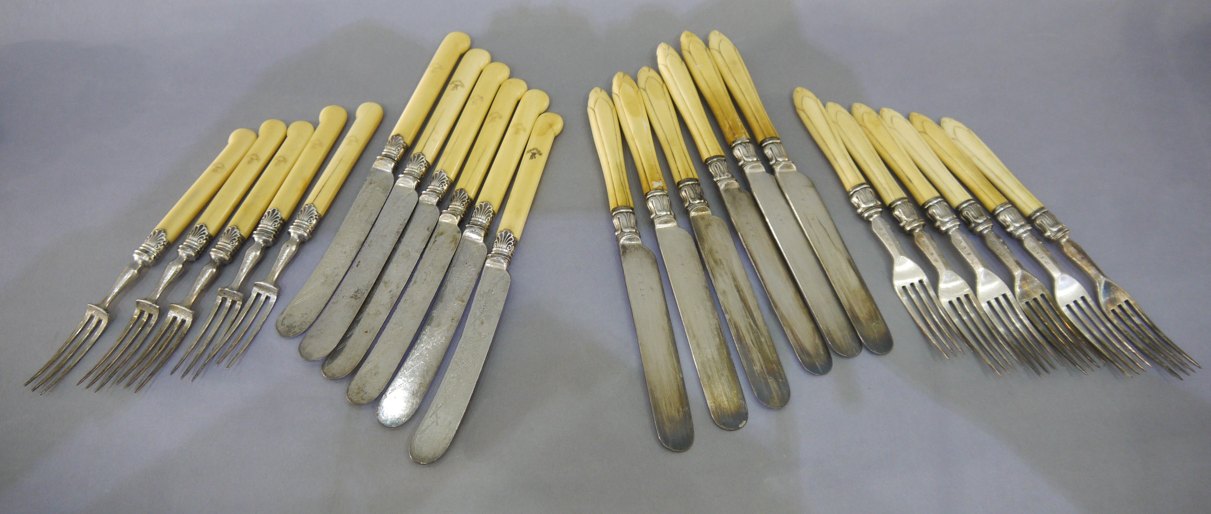 Two sets of dessert knives and forks,
