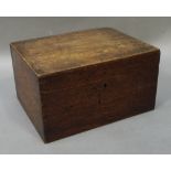 An oak box with hinged lid and fitted tray containing a selection of costume jewellery including