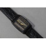 A fake Omega wristwatch in a rectangular black composite case with steel back,