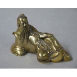 A 19th century bronze incense burner modelled as a reclining deity, 10.