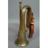 A copper bugle with applied Sutherland & Argyle brass badge, 29cm high,