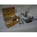 A mid 20th century watch makers lathe complete with bed and chucks, cutting tools,