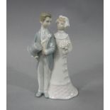 A Lladro figure group of a wedding couple,