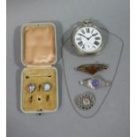 A Victorian open faced pocket watch in a nickel case, together with a Victorian silver boss brooch,