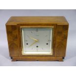 An Elliott mantel clock with figured mahogany case, gilt brass bezel and dial with numerals at 12,