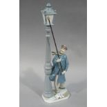 A Lladro figure of a lamp lighter,