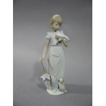 A Lladro Collectors Society, 1991, figure of a young woman with umbrella in her right hand,