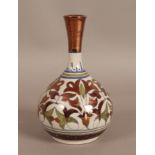 A French pottery bottle shaped vase with tall waisted neck,