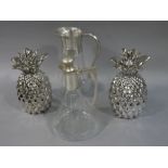 A pair of reproduction silvered pottery pineapples,