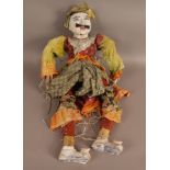 An Indian marionette puppet, the painted wooded head with glass eyes and hair moustache,