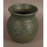 Grayshott - a ribbed baluster vase with everted neck,