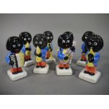 A set of eight reproduction Robertson's style band figures,