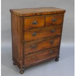 A late Victorian/Edwardian mahogany chest of two short and three long drawers on turned feet